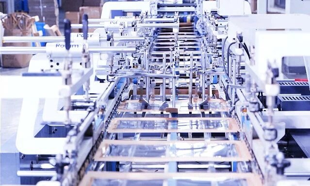 Modern food packaging factory with semi-automatic lines, OPP bagging and quality inspection stations